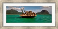 Framed Rock in Indian Ocean with mountain the background, Le Morne Mountain, Mauritius Island, Mauritius