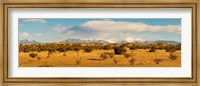 Framed High desert plains landscape with snowcapped Sangre de Cristo Mountains in the background, New Mexico