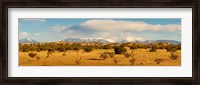 Framed High desert plains landscape with snowcapped Sangre de Cristo Mountains in the background, New Mexico