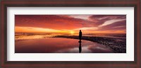 Framed Silhouette of human sculpture on the beach at sunset, Another Place, Crosby Beach, Merseyside, England