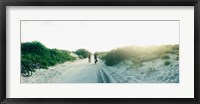 Framed Rear view of a couple cycling along a beach trail, Fort Tilden, Queens, New York City, New York State, USA