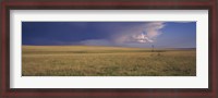 Framed Lone windmill in a field, New Mexico, USA