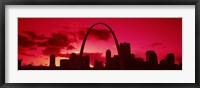 Framed Gateway Arch with city skyline at sunset, St. Louis, Missouri