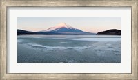 Framed Yamanaka Lake covered with ice and Mt Fuji in the background, Yamanakako, Yamanashi Prefecture, Japan