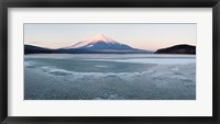 Framed Yamanaka Lake covered with ice and Mt Fuji in the background, Yamanakako, Yamanashi Prefecture, Japan