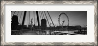 Framed Bridge across a river with a ferris wheel, Golden Jubilee Bridge, Thames River, Millennium Wheel, London, England