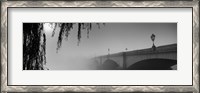 Framed Putney Bridge during fog, Thames River, London, England (black and white)