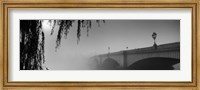 Framed Putney Bridge during fog, Thames River, London, England (black and white)