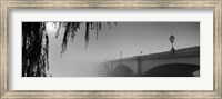 Framed Putney Bridge during fog, Thames River, London, England (black and white)