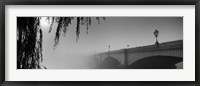 Framed Putney Bridge during fog, Thames River, London, England (black and white)