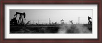Framed Oil drills in a field, Maricopa, Kern County, California (black and white)