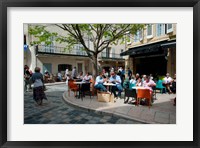 Framed Tourists at sidewalk cafes, Lourmarin, Vaucluse, Provence-Alpes-Cote d'Azur, France