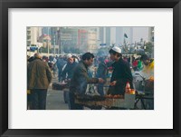Framed Muslim Chinese Uyghur minority food vendors selling food in a street market, Pudong, Shanghai, China