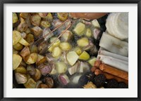 Framed Fried potatoes and snacks on the grill in a street market, Old Town, Lijiang, Yunnan Province, China