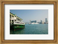 Framed Star ferry on a pier with buildings in the background, Central District, Hong Kong Island, Hong Kong