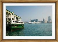 Framed Star ferry on a pier with buildings in the background, Central District, Hong Kong Island, Hong Kong