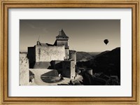 Framed Chateau de Castelnaud with hot air balloon flying over a valley, Castelnaud-la-Chapelle, Dordogne, Aquitaine, France