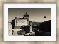 Framed Chateau de Castelnaud with hot air balloon flying over a valley, Castelnaud-la-Chapelle, Dordogne, Aquitaine, France