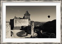 Framed Chateau de Castelnaud with hot air balloon flying over a valley, Castelnaud-la-Chapelle, Dordogne, Aquitaine, France