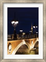Framed Pont de Pierre bridge across Garonne River with Eglise St-Michel at dusk, Bordeaux, Gironde, Aquitaine, France