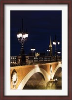 Framed Pont de Pierre bridge across Garonne River with Eglise St-Michel at dusk, Bordeaux, Gironde, Aquitaine, France