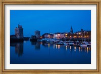 Framed Tour St-Nicholas and Tour de la Chaine towers at dawn, Old Port, La Rochelle, Charente-Maritime, Poitou-Charentes, France