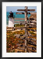 Framed Directional signs on a pole with light house in the background, Point Montara Lighthouse, Montara, California, USA