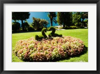 Framed Topiary and flower bed in a garden, Villa Carlotta, Tremezzo, Como, Lombardy, Italy