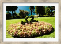 Framed Topiary and flower bed in a garden, Villa Carlotta, Tremezzo, Como, Lombardy, Italy