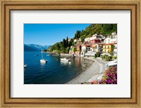 Framed Houses at waterfront with boats on Lake Como, Varenna, Lombardy, Italy
