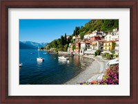 Framed Houses at waterfront with boats on Lake Como, Varenna, Lombardy, Italy