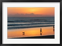 Framed Silhouette of people and dog walking on the beach, Seminyak, Kuta, Bali, Indonesia