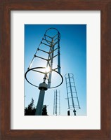 Framed Low angle view of vertical windmills