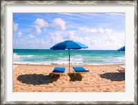 Framed Lounge chairs and beach umbrella on the beach, Fort Lauderdale Beach, Florida, USA