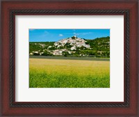 Framed Farm with a town in the background, Simiane-La-Rotonde, Alpes-de-Haute-Provence, Provence-Alpes-Cote d'Azur, France