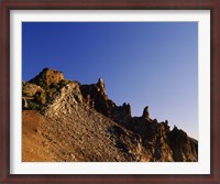 Framed Hillman Peak crags at sunrise, Crater Lake National Park, Oregon, USA