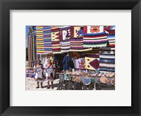 Framed Two female vendors dressed in Mayan costumes displaying products