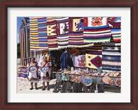 Framed Two female vendors dressed in Mayan costumes displaying products