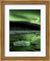 Framed Aurora Borealis reflects off the Tennevik River, Troms County, Norway
