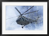 Framed Bulgarian Air Force Mi-17 helicopter over a forest fire in Bulgaria