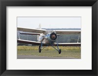 Framed Antonov An-2 taking off from an airfield in Bulgaria