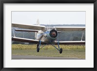 Framed Antonov An-2 taking off from an airfield in Bulgaria