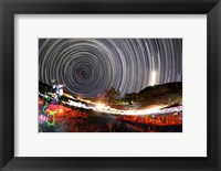 Framed Astronomers observe polar star trails above a mountain in Iran
