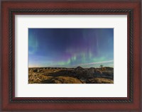 Framed Aurora borealis over the badlands of Dinosaur Provincial Park, Canada