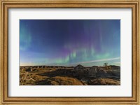 Framed Aurora borealis over the badlands of Dinosaur Provincial Park, Canada