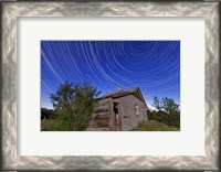 Framed Circumpolar star trails above an old farmhouse in Alberta, Canada