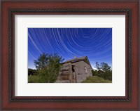 Framed Circumpolar star trails above an old farmhouse in Alberta, Canada