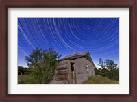 Framed Circumpolar star trails above an old farmhouse in Alberta, Canada