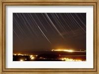 Framed Star trails above a village in the central desert of Iran