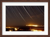 Framed Star trails above a village in the central desert of Iran